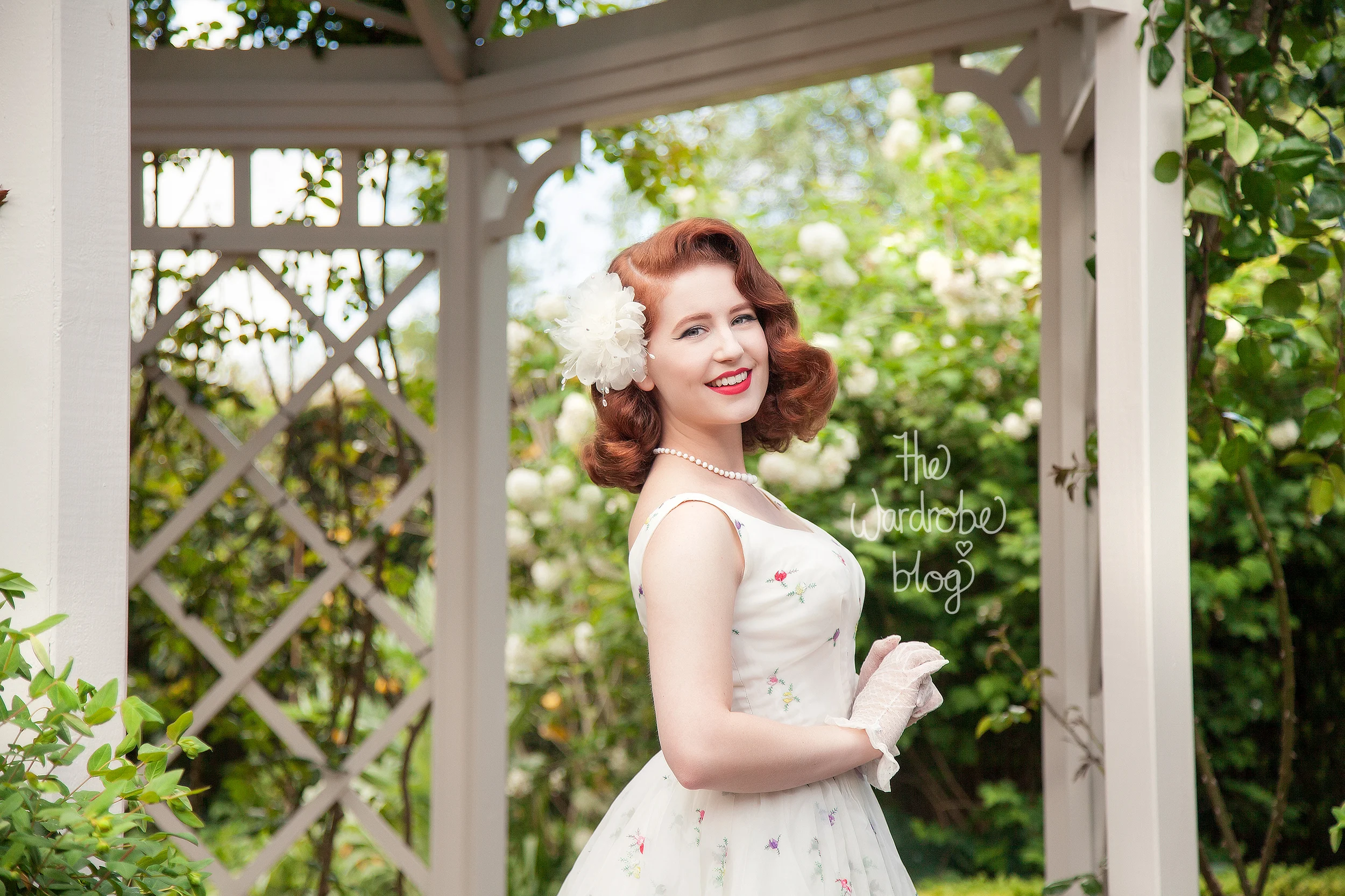Miss Hero Holliday wears a Vintage Dress, gloves, necklace and hair piece.&nbsp;