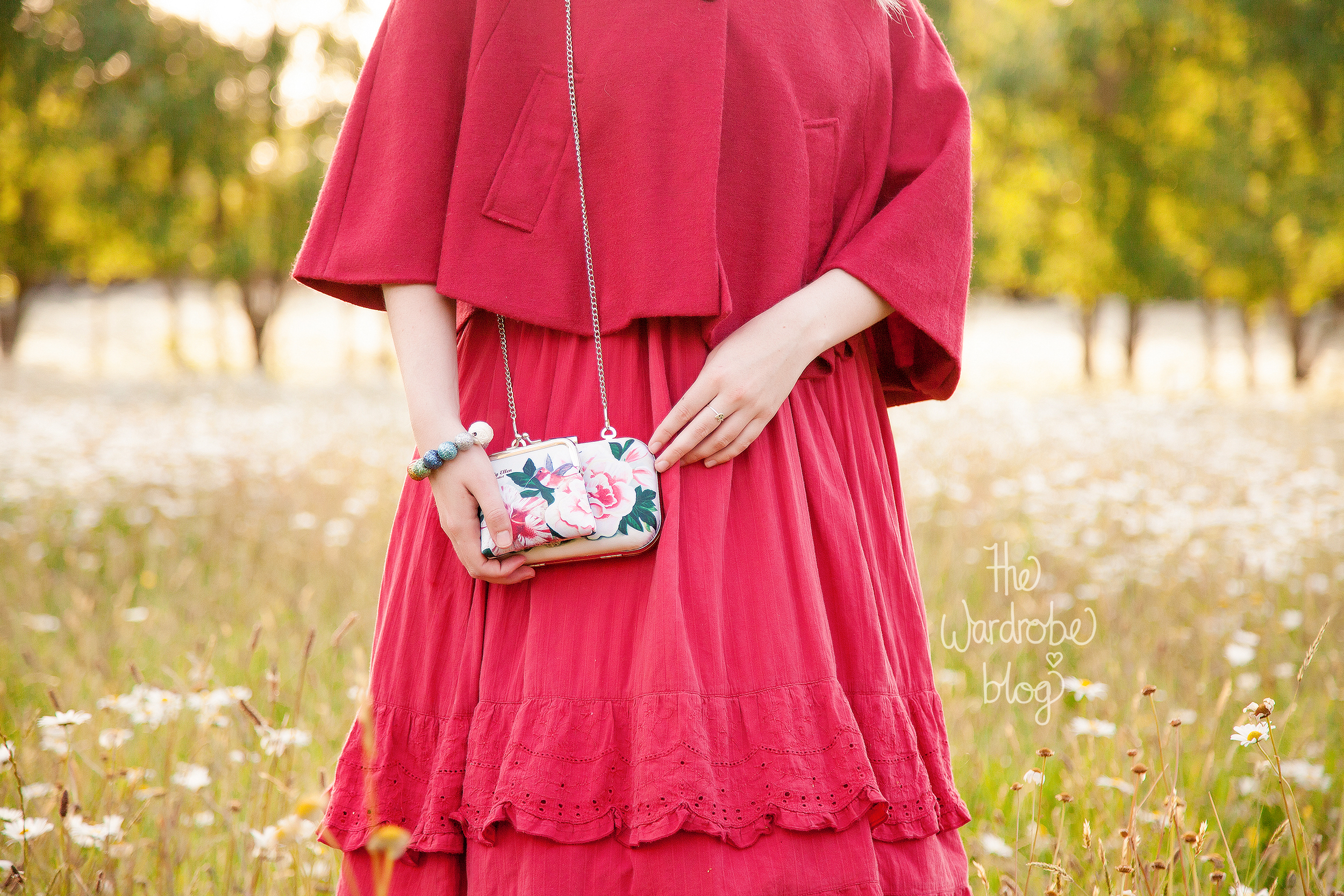 Mantle from Valleygirl, Dress from Just Jeans, Petticoat from Rita Sue Clothing, Bags from Moxie Mama Wear,&nbsp;Hair flowers + Bracelet from  Shop The Wardrobe .