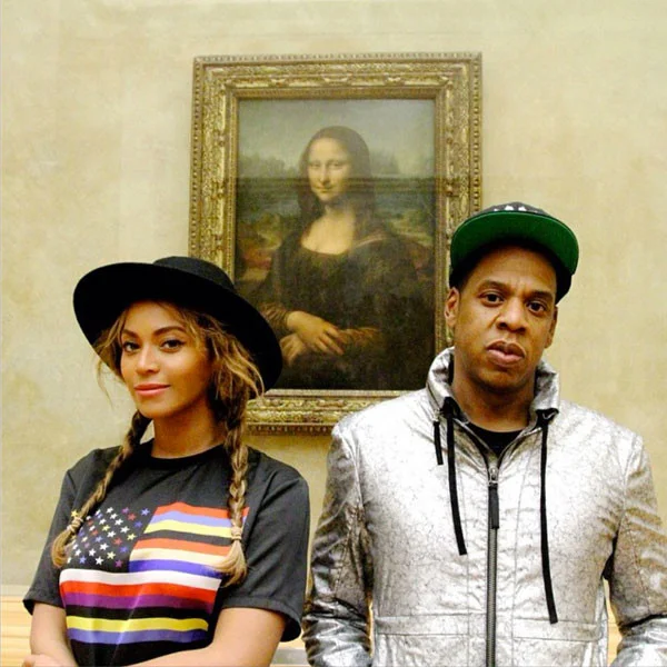 Beyoncé and Jay Z, with the Mona Lisa at the Louvre. Photo via: Twitter