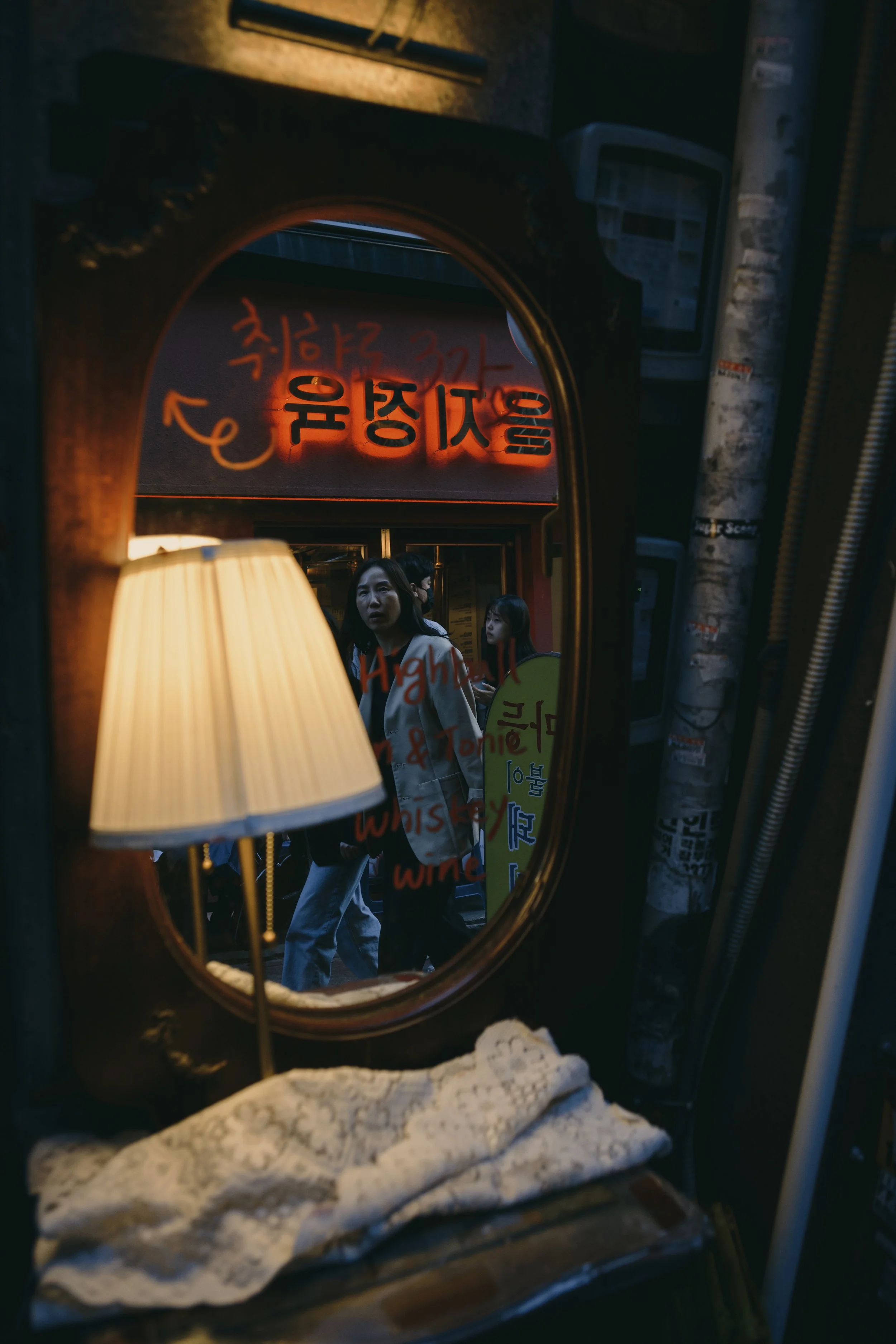 A woman in a mirror reflection in Seoul, South Korea