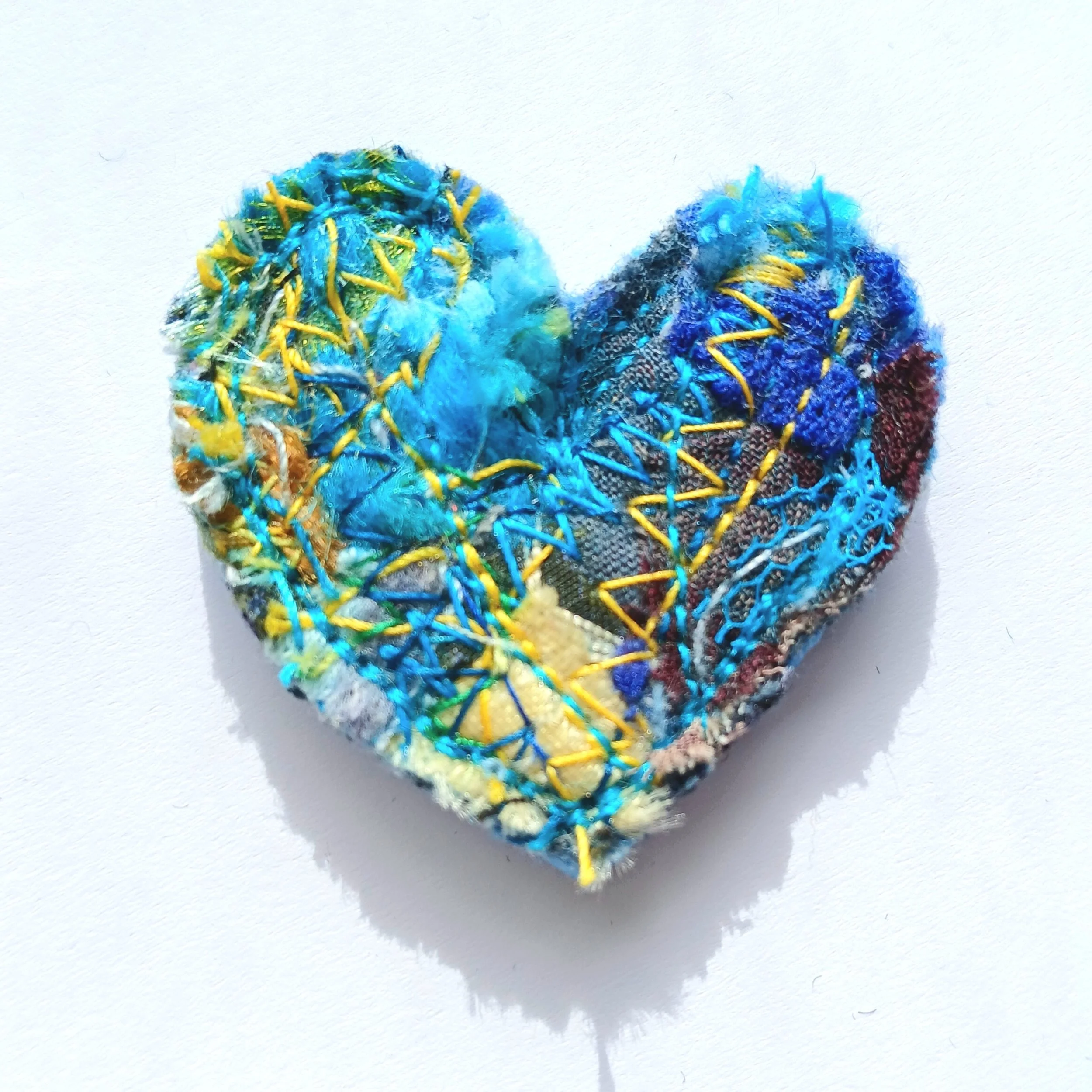 Anne Bulmer Handmade Brooches by Anne Blue Textile Brooch300 brochure image.jpg