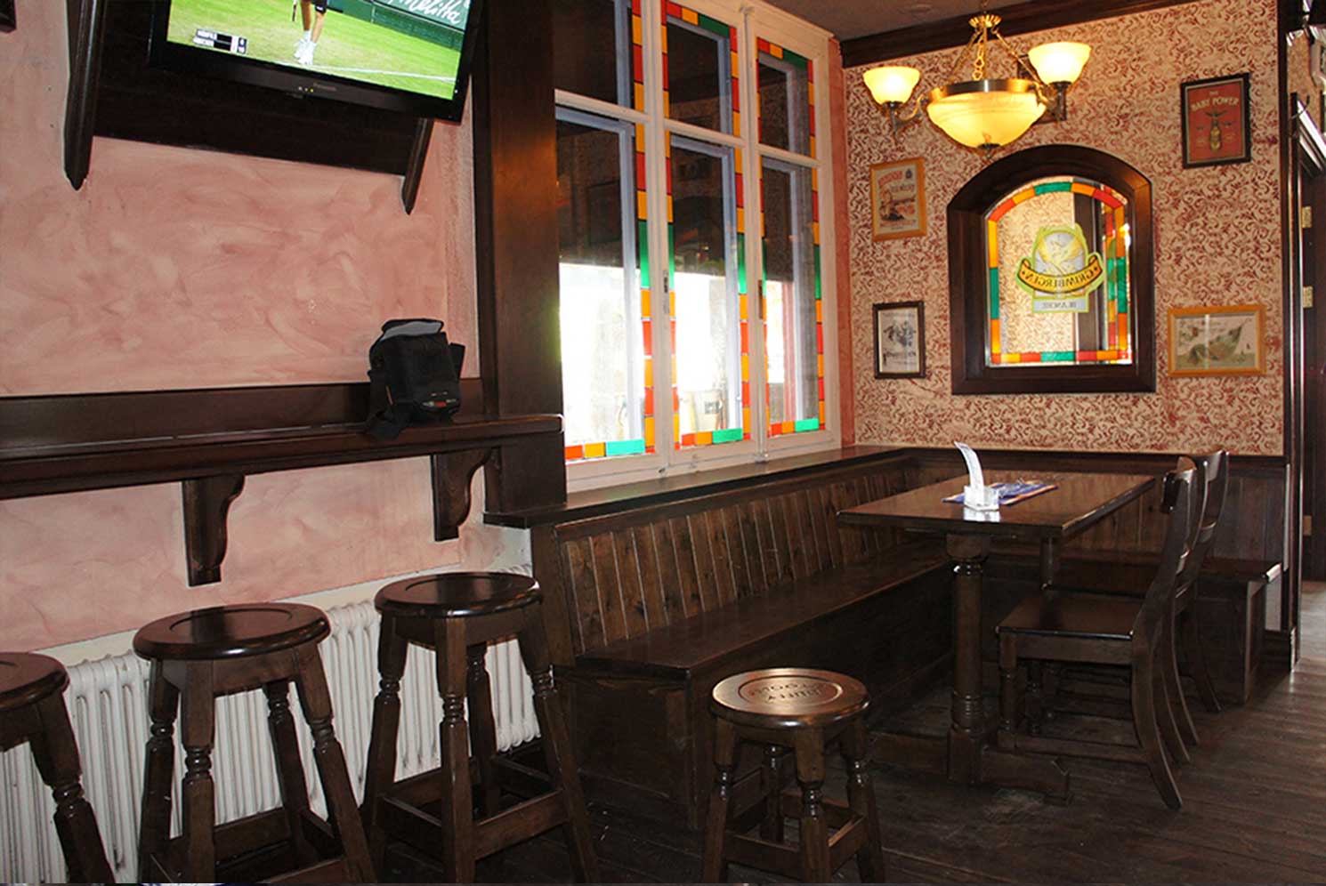 Duffy O'Tooles authentic Irish pub design - interior view of stained glass windows and adorned mirrors.&nbsp;
