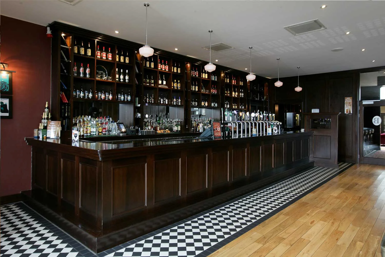 Bewley's hotel bar design - dark wood bar designed by Guinness approved designers&nbsp;
