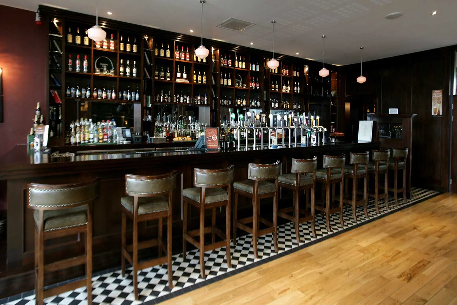 Bewley's Hotel Bar design - interior view of bar with stools lined up&nbsp;