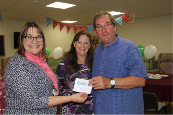 Alan Robinson, our first ever jackpot winner, here pictured receiving his Founder Member Badge.