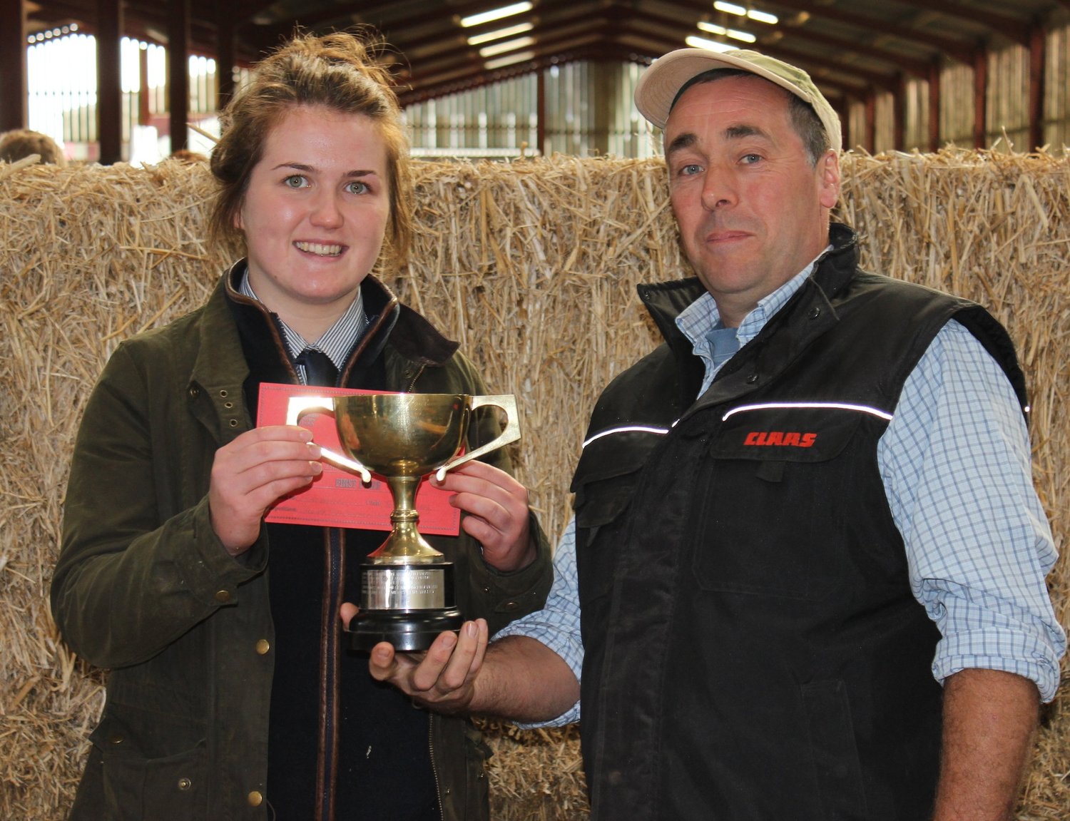 Junior Stockman of the Year Winner - Ella Harris Teme Valley YFC being presented with her trophy from venue host Christopher Morris.