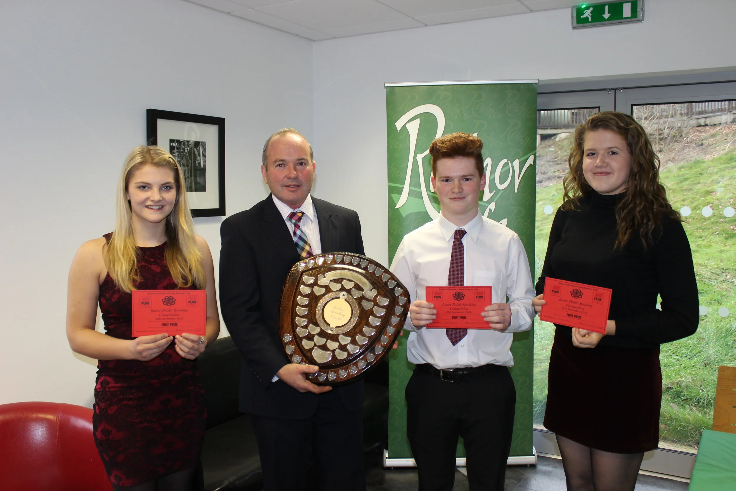 Junior Public Speaking Winners Annie Fairclough, Rhys Bennett & Gemma Price, Llanbadarn Fynydd YFC with Judge Mr Russell Williams.