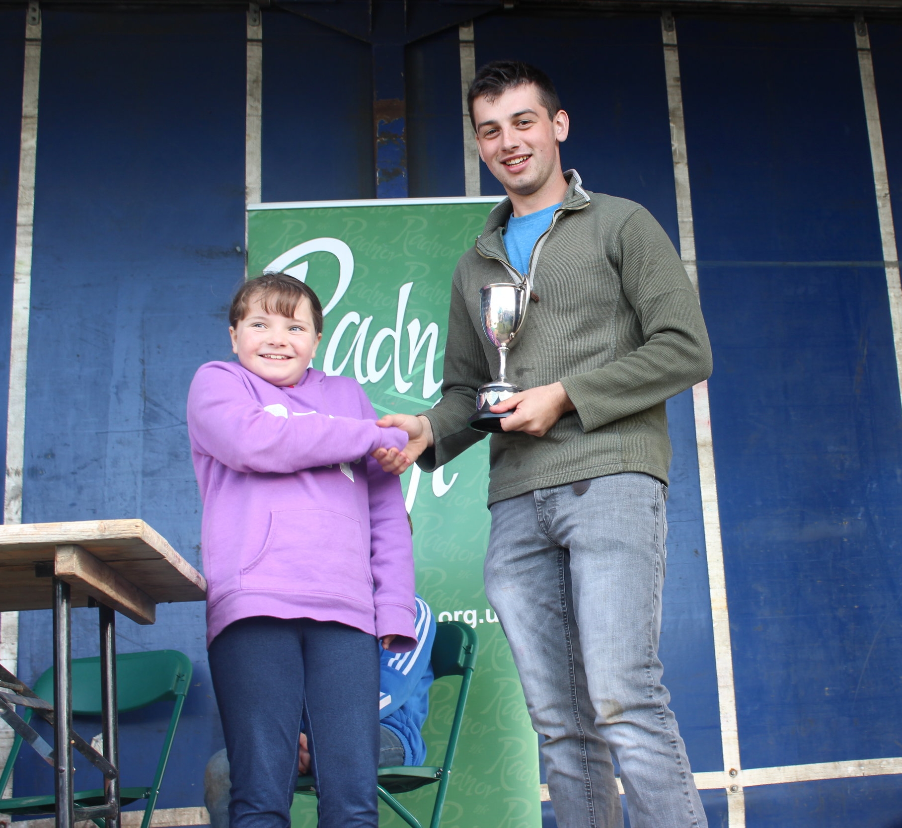 William Davies, Edw Valley YFC being presented with the Messers J & P Turner Ltd Perpetual Challenge Cup for the highest marks in the Carcase Judging, with our Sponsor representative Lizzy Hughes of JHS.