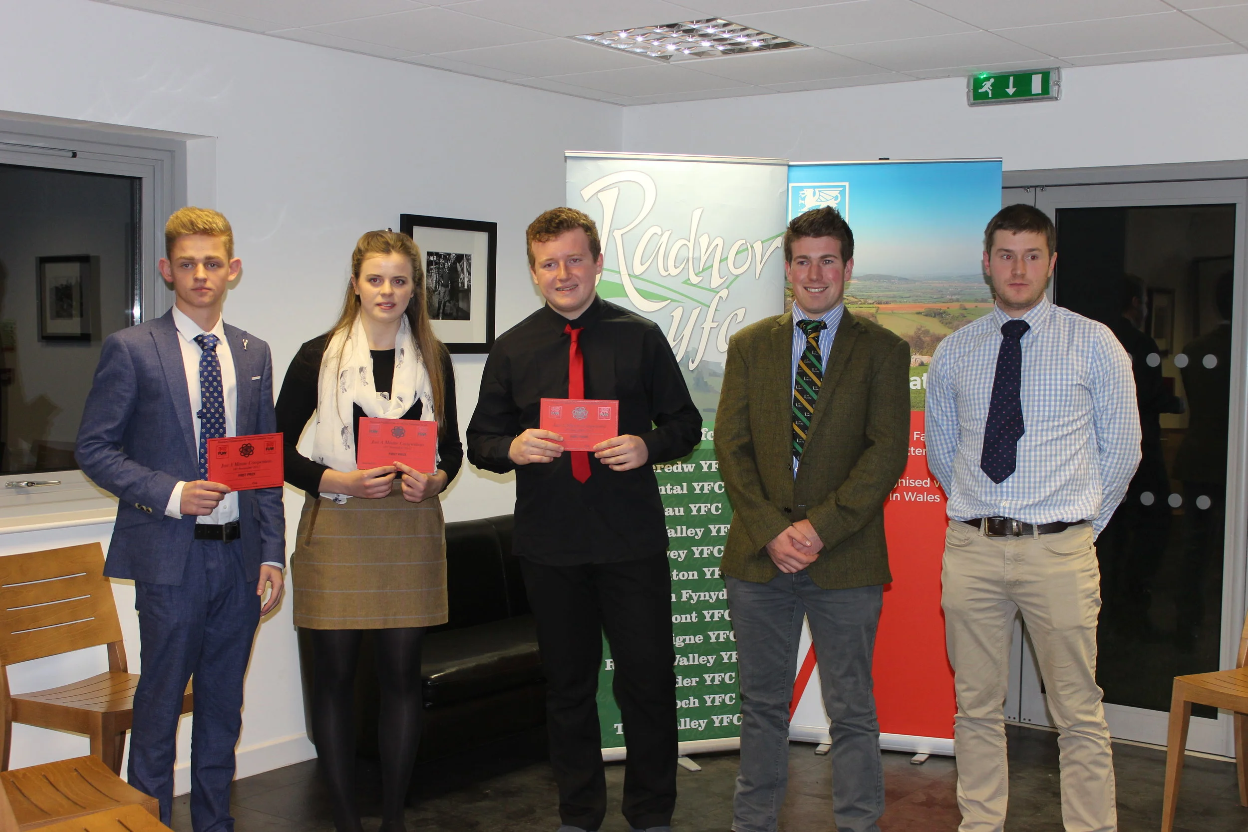 Ben Chilman & Elizabeth Preston, Presteigne YFC & Teddy Mitchell, Edw Valley YFC winning the Just A Minute Competition with judges Joe Williams & Mark Hanson.