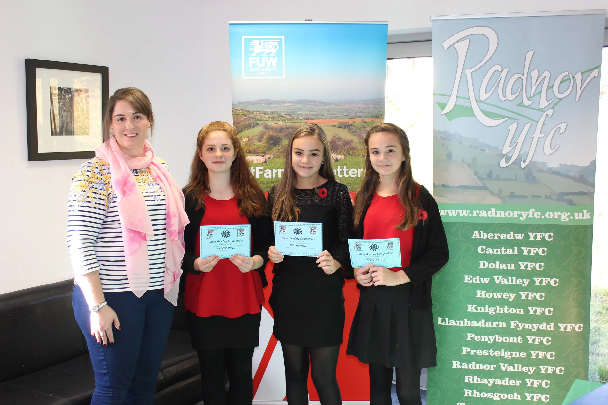Carys Moore, Katie Hammonds & Evie Hammonds coming second in the Junior Reading competition with judge Emma Bayona Martinez.