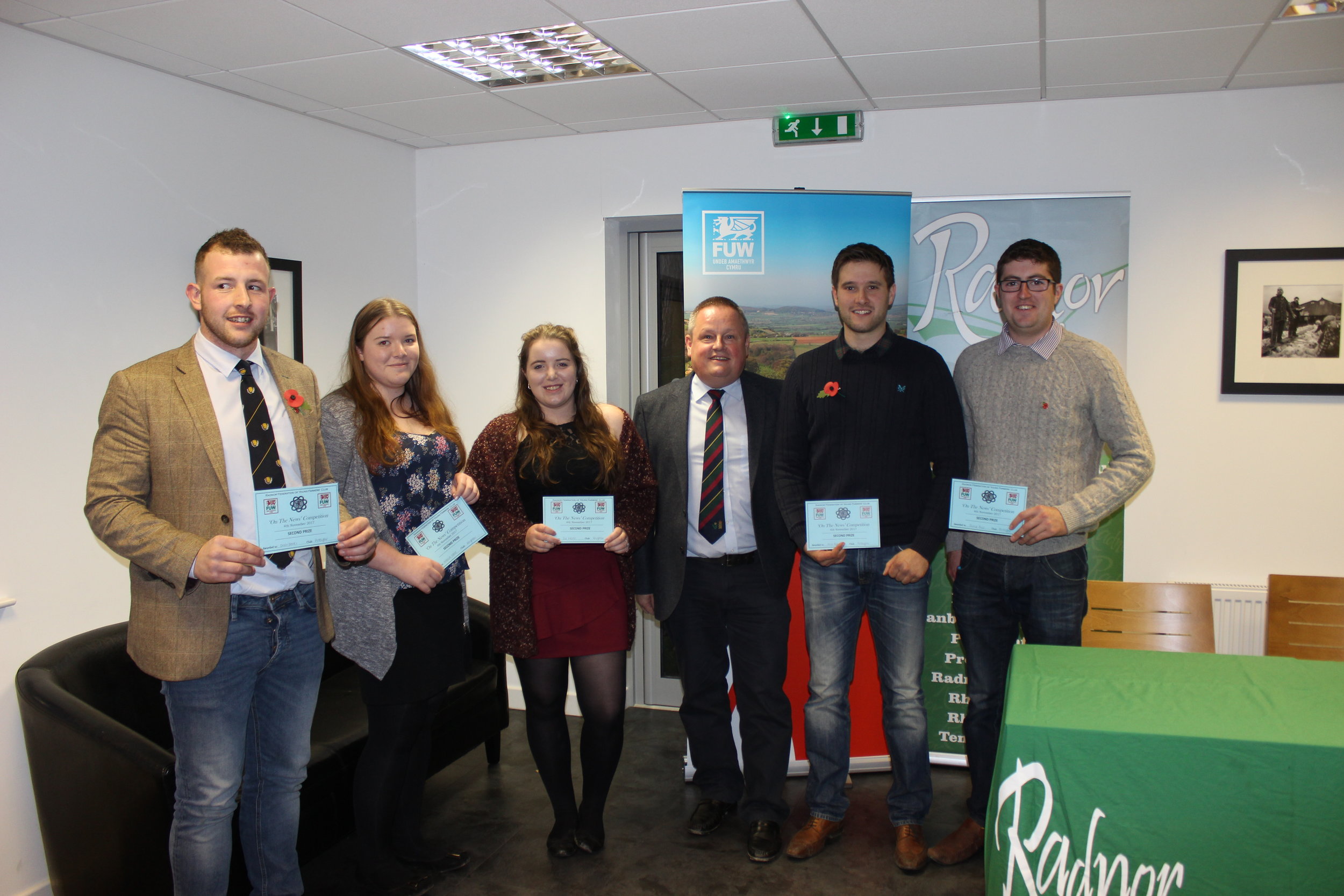 Owen Davies, Natalie Wood, Cerys Wood, William Rogers & Jamie Price, Presteigne YFC & Knighton YFC gaining joint 2nd in the 'On The News' Competition with judge Trevor Owens.