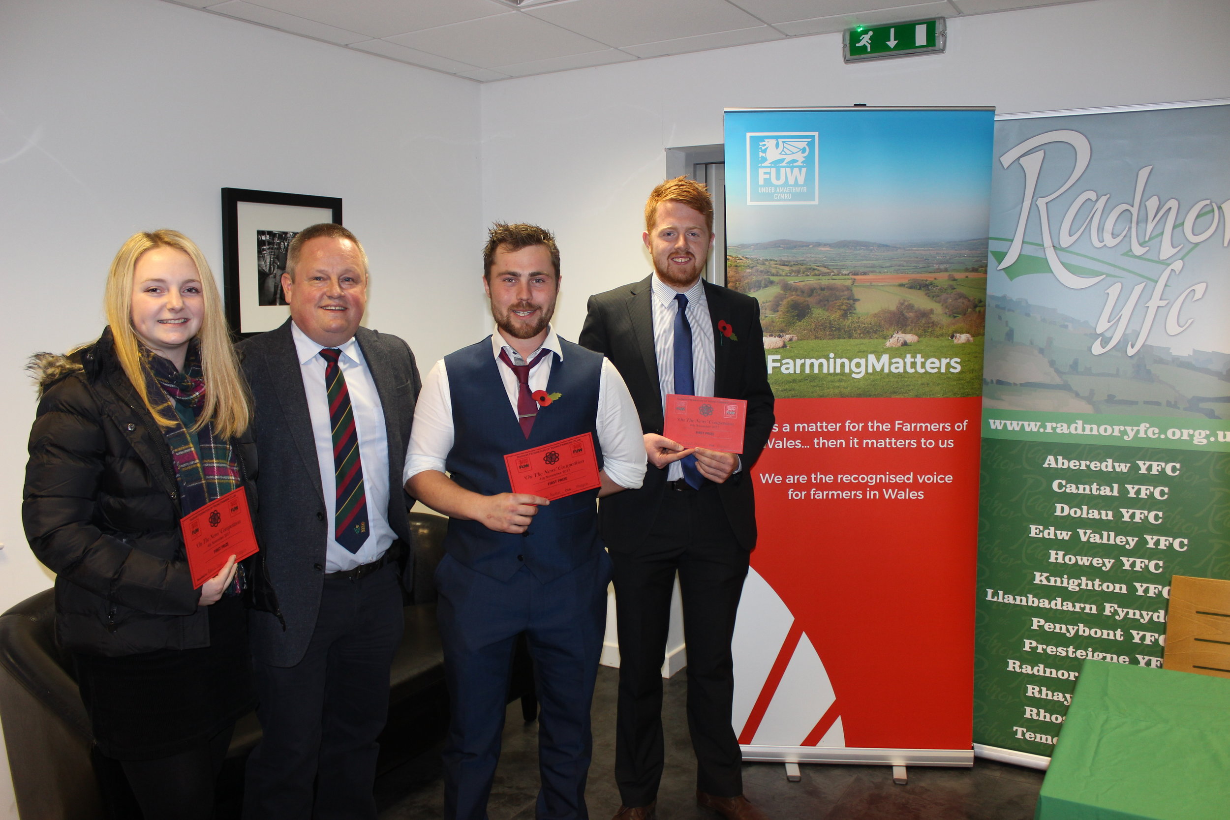 Rebecca Lloyd, James Poulton and Richard Meredith, Rhosgoch YFC with judge Trevor Owens winning the 'On The News' Competition.