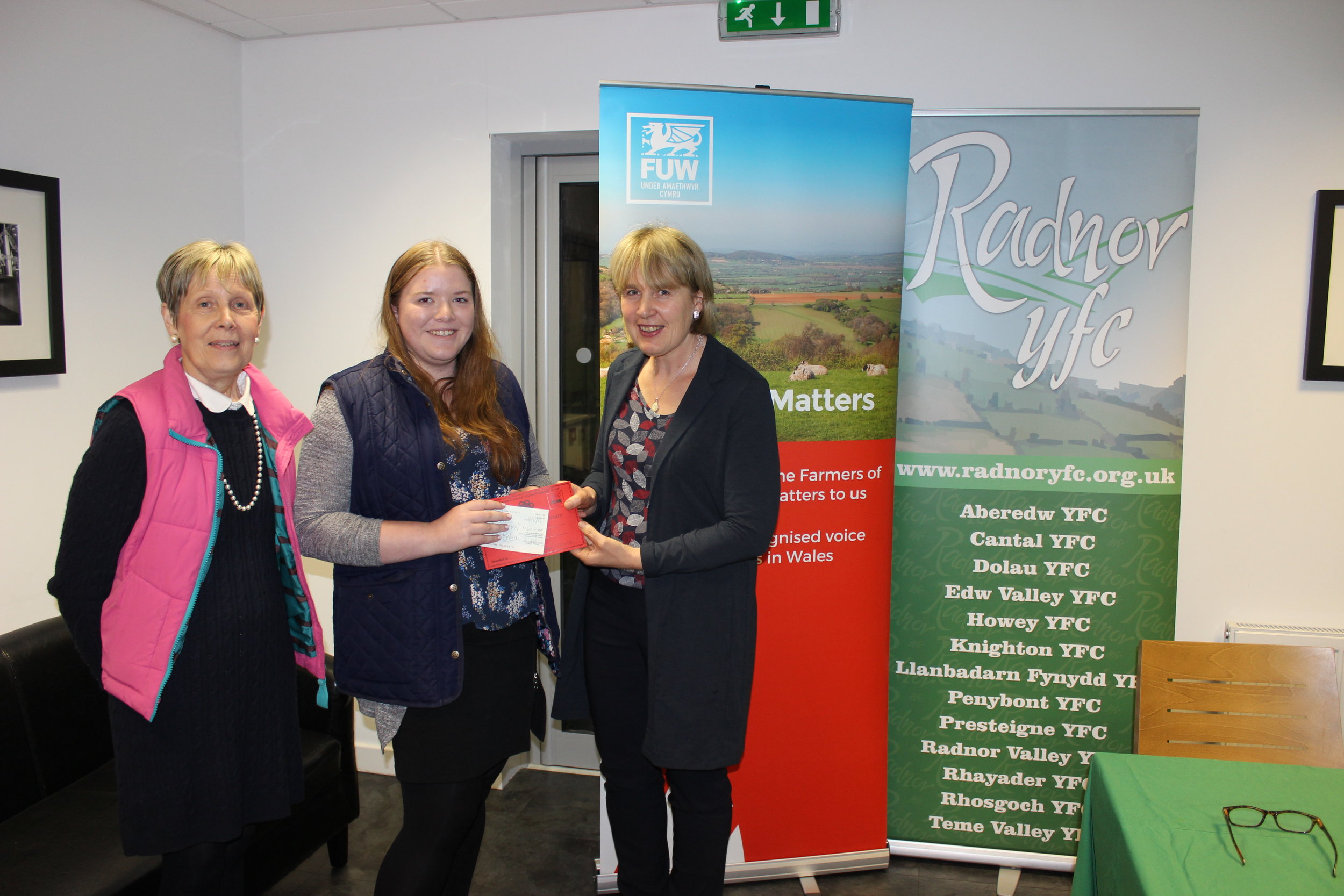 Natalie Wood, Knighton YFC winning the Bursary Competition with judges Rhian Duggan & Gill Price.