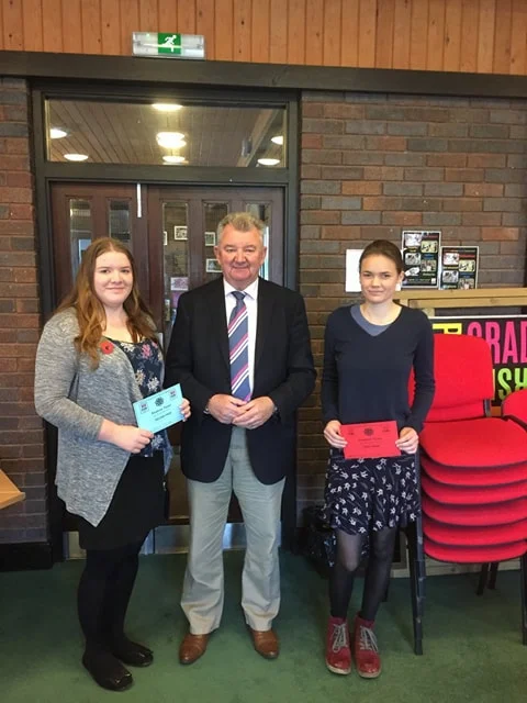 Natalie Wood, Knighton YFC & Mollie Hooper, Presteigne YFC with judge Clive Alexander in the Situation Vacant competiton.