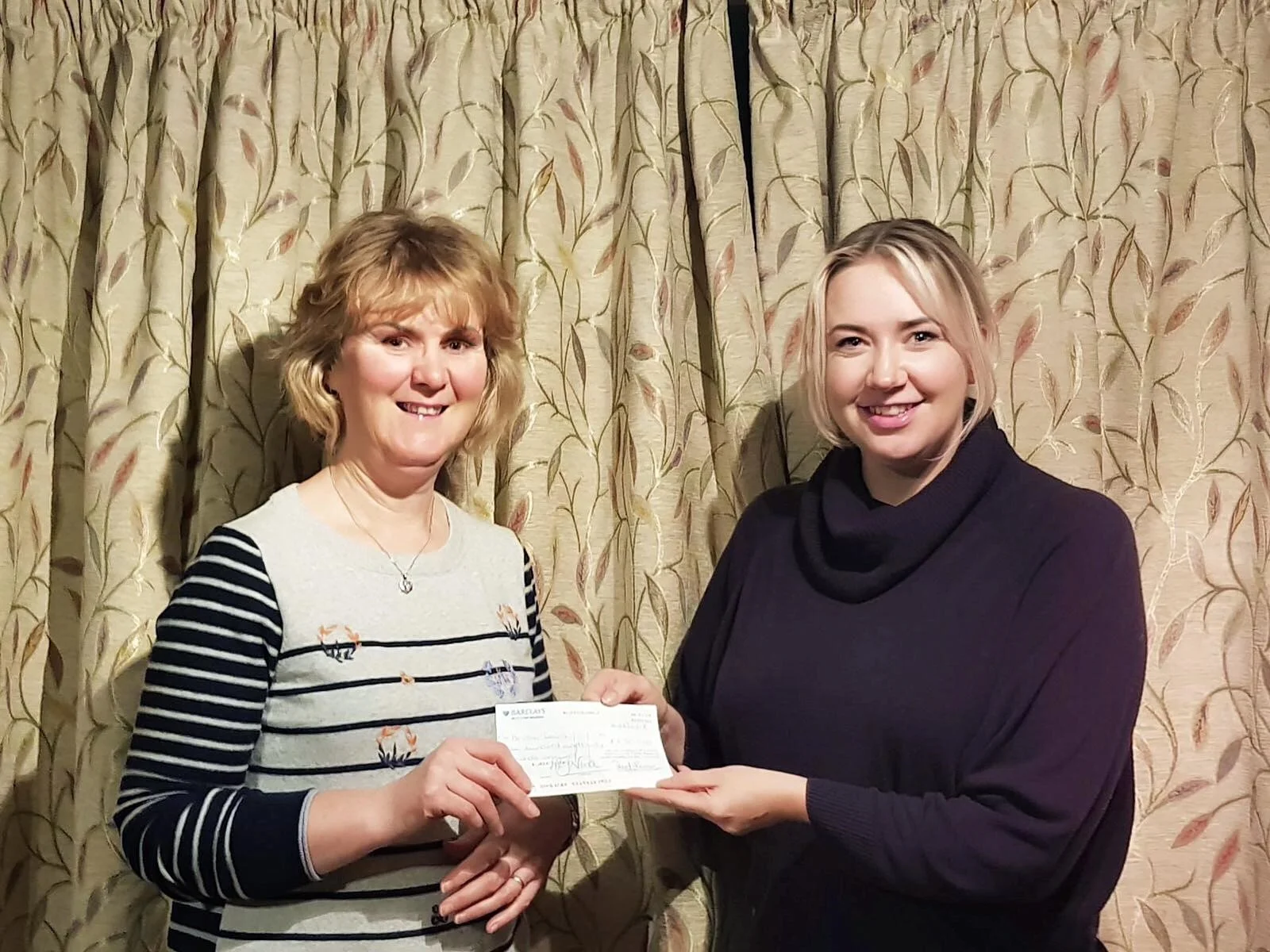 Heather Lewis being presented £630 from Gemma Bufton, 2017-2018 County Chairman,