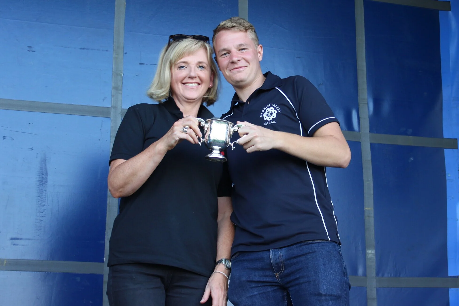 Louise Pugh presenting Club Chairman of Radnor Valley YFC with the ‘Hector Morris Challenge Cup’ for th most marks gained in the Home Crafts section.
