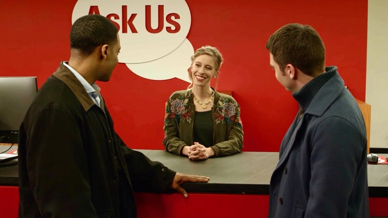 In a scene from Oh Crappy Day , Jaime Wallace (Meghan) wears an embroidered jacket provided by Galatea Boutique of Raleigh. With her, from left to right, are Loosha Jones (Marcus) and Jordan Estes (Jared).