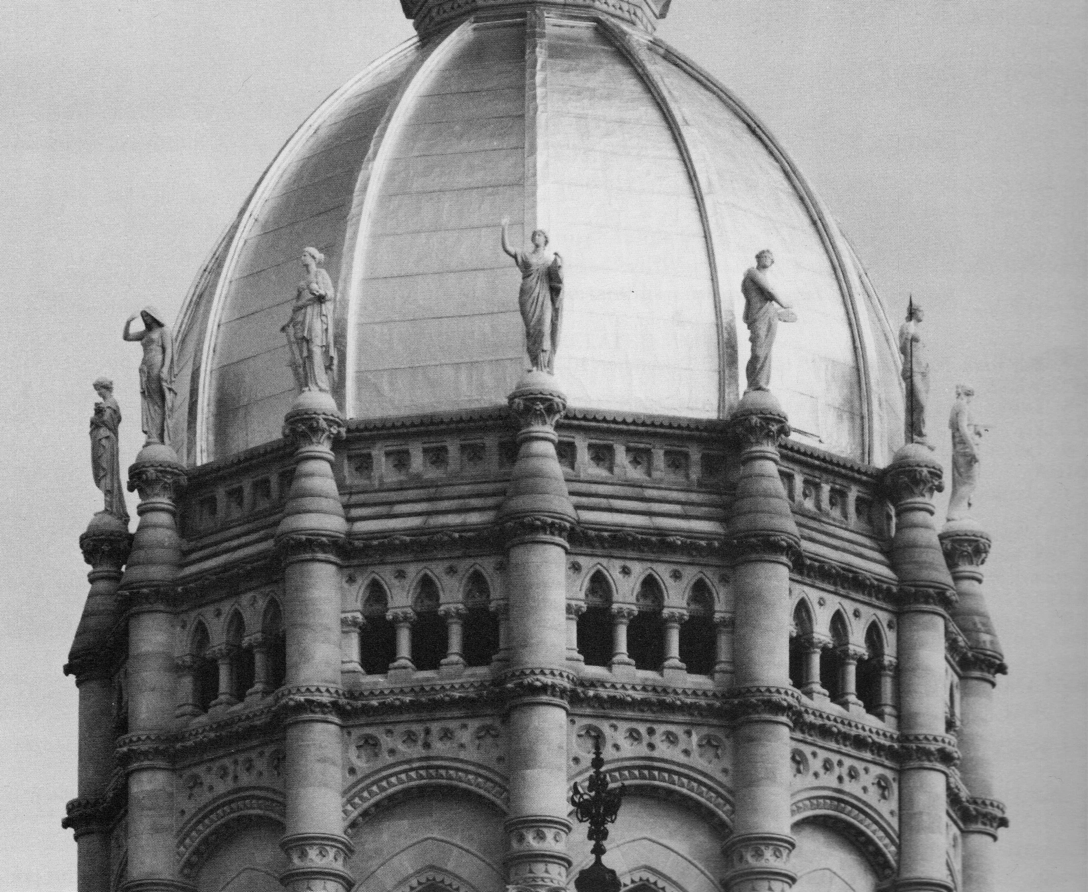 The dome of the State Capitol Building with 12 marble statues .
