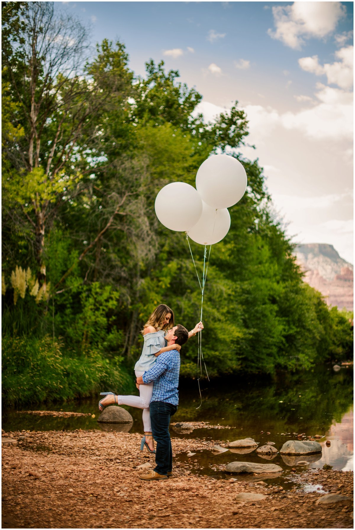  Summer Sedona Engagement Photos with balloons and the Sedona Red Rock Mountains in the background. 