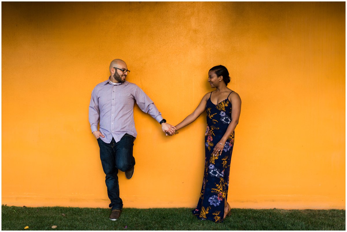  Interracial Couple Engagement Photos in Mesa with a colorful wall.&nbsp; 