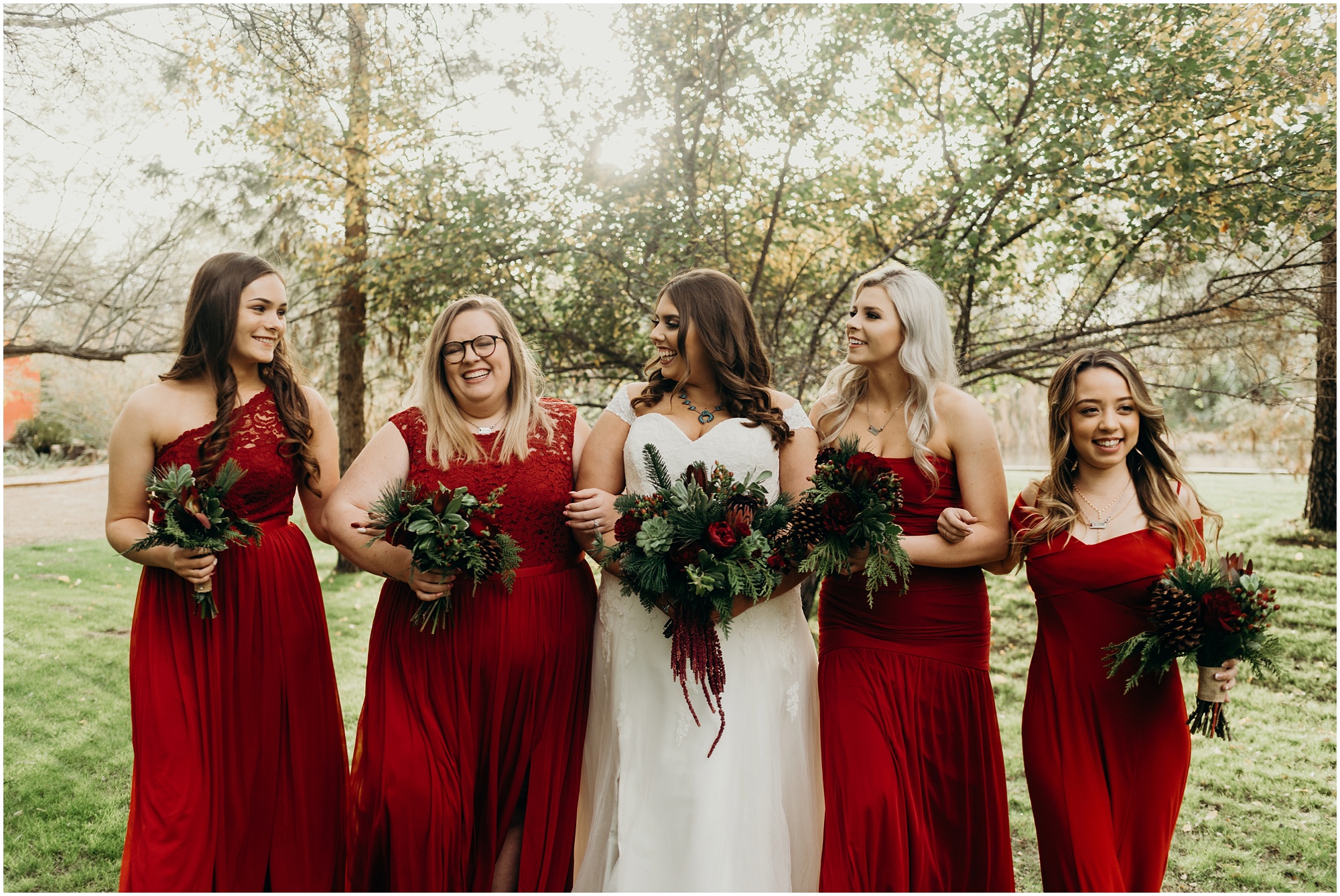 Candid and fun bridesmaids photos with red bridesmaids dresses for a Christmas Wedding.
