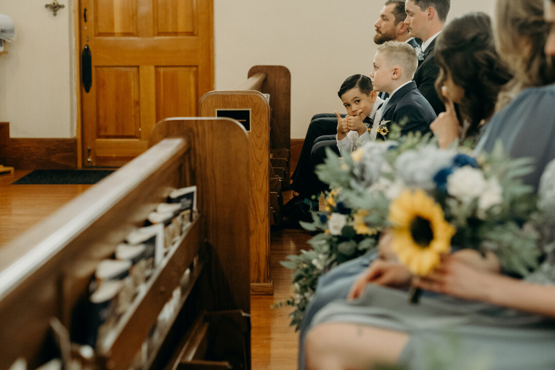 I love watching kids during weddings. This sweet ring bearer leans over and gives his mom, a bridesmaid, a thumbs up in the middle of the ceremony.​​​​​​​​
Adam + Danielle // March 2022​​​​​​​​
.​​​​​​​​
.​​​​​​​​
.​​​​​​​​
.​​​​​​​​
. ​​​​​​​​
#azwe