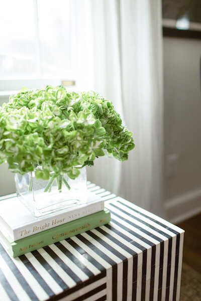 The Faint Pinstripes in the Curtains Complement the Bolder Stripping in the Accent Table