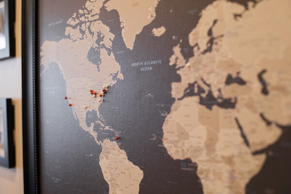 A Framed Pushpin Map Helps the Family Remember Their Travels Together