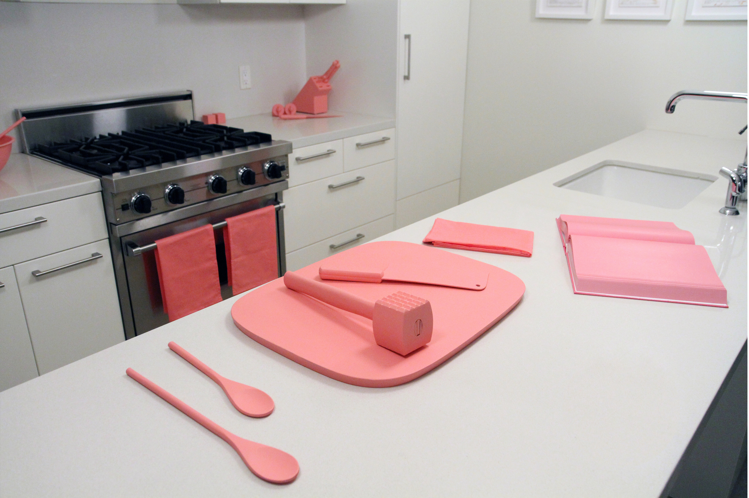   The Schauss Kitchen  Baker-Miller Pink painted kitchen objects, fabric, Baker-Miller Pink "cookbook" Installation dimensions variable Marine Contemporary Art Salon, Venice, CA. 2013 Photo Courtesy of Sean Flaherty 