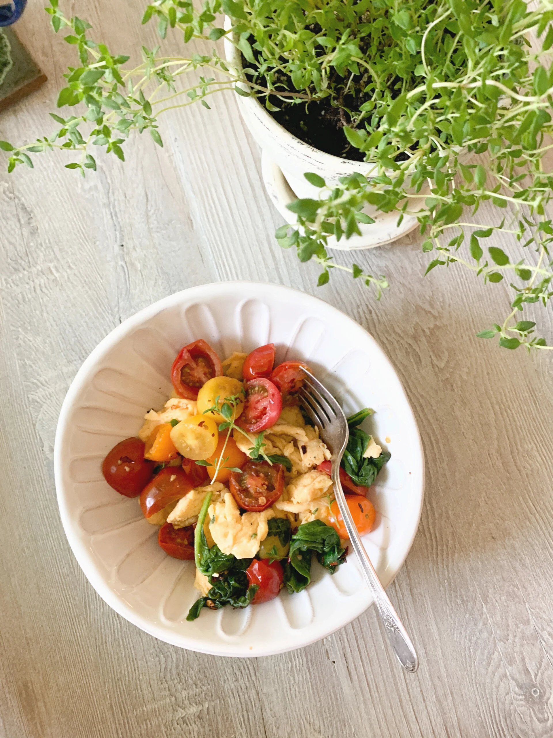 EGG SCRAMBLE WITH SPICY BLISTERED TOMATOES, FRESH THYME AND SPINACH 