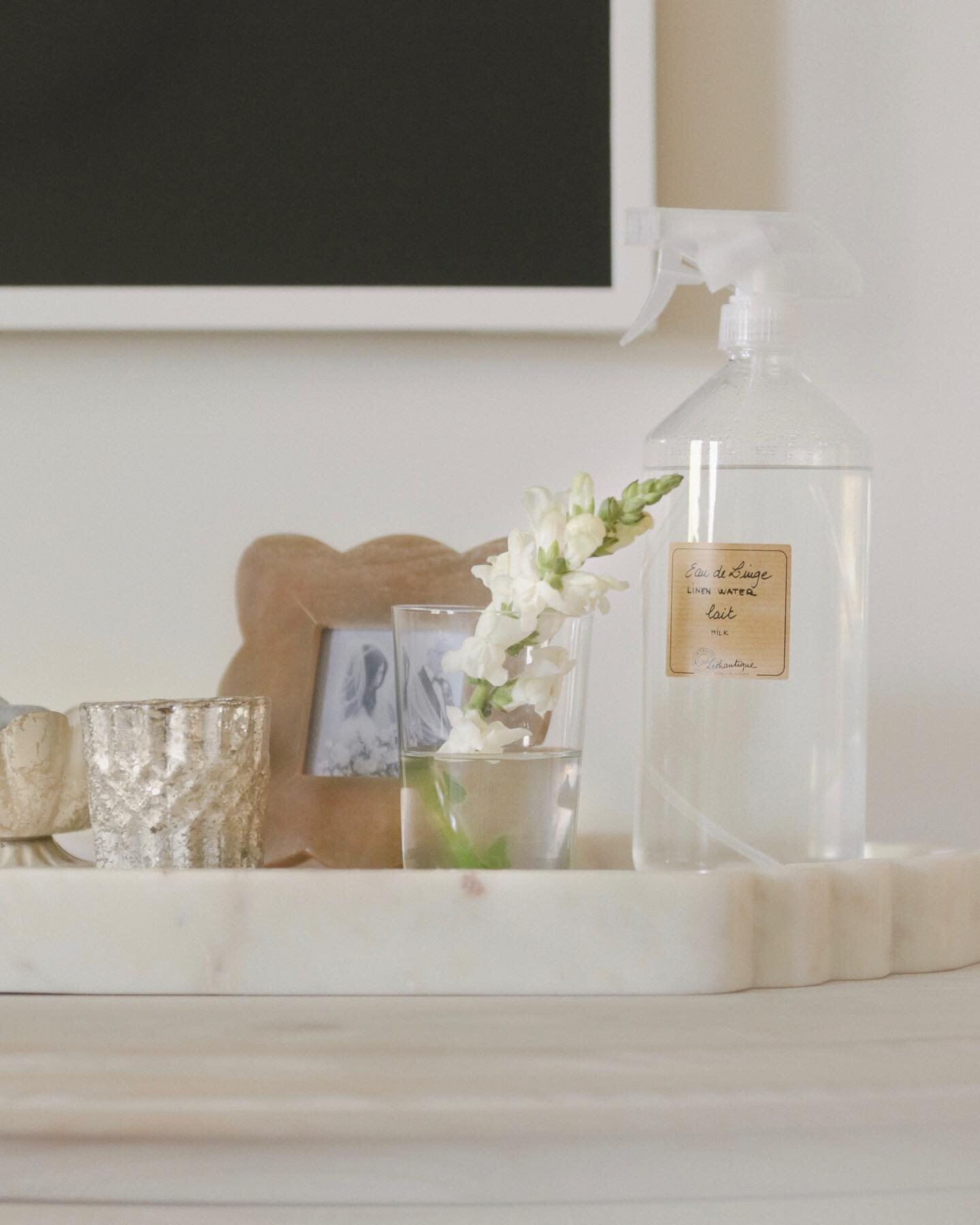 My favorite spot in our home right now is our bedroom and this little vignette in particular. The days are busy and full right now and having a nice room with candles lit, fresh flowers and a made bed is everything lol.