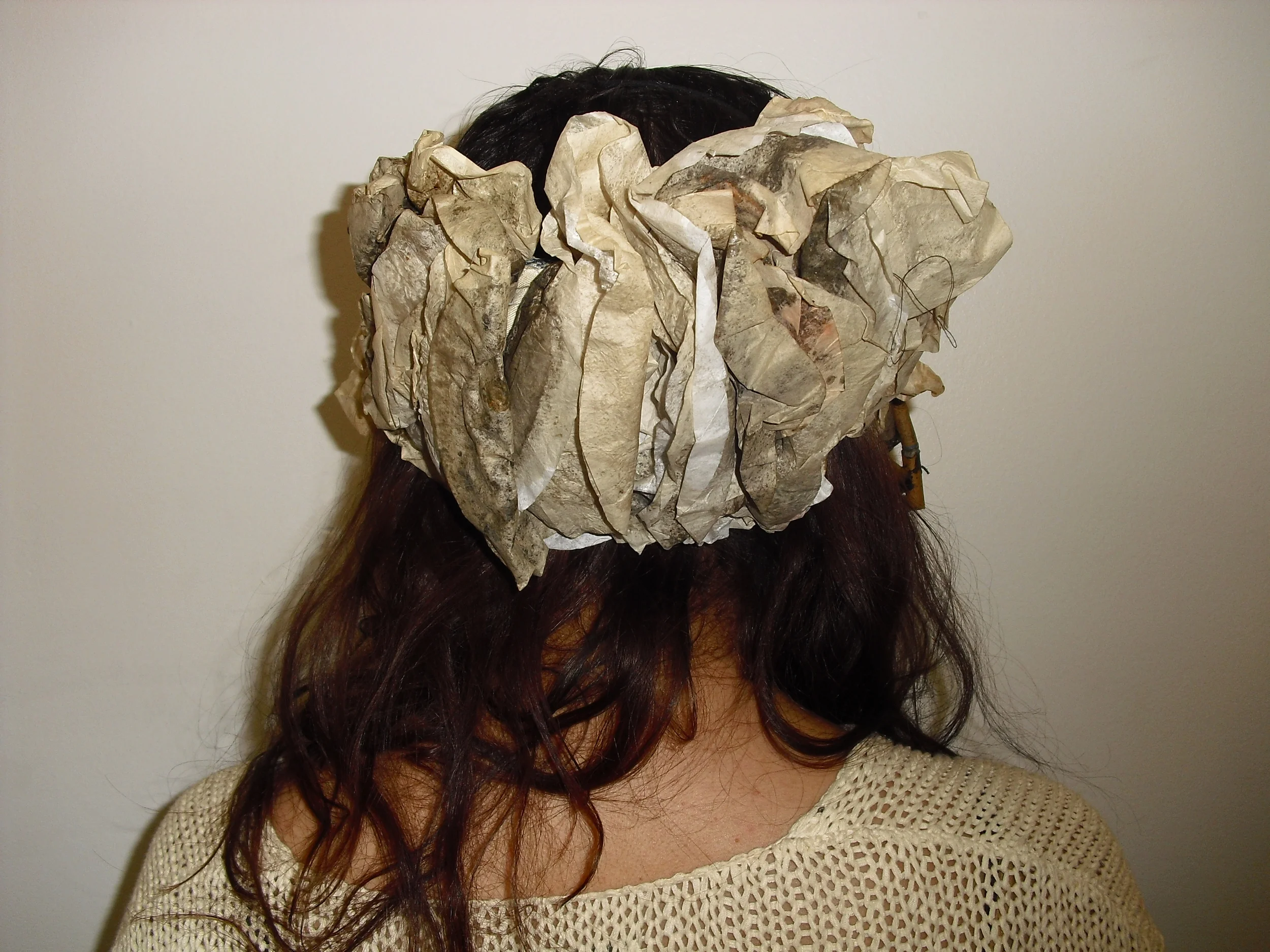  Materials: Found Cigarette Butts, used Coffee Filters, and nylon string. 