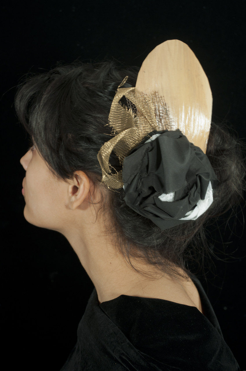 Materials: Found palm leaf, brass wire, repurposed fabric and lace trim. 