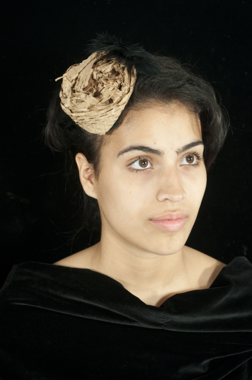 Materials: Repurposed faux feathers, and brown paper filler.