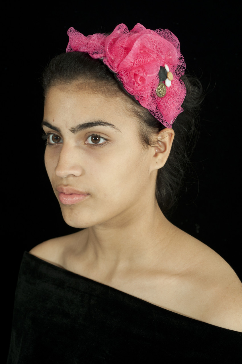 Materials: Repurposed body mesh sponge, buttons, and nylon fabric.