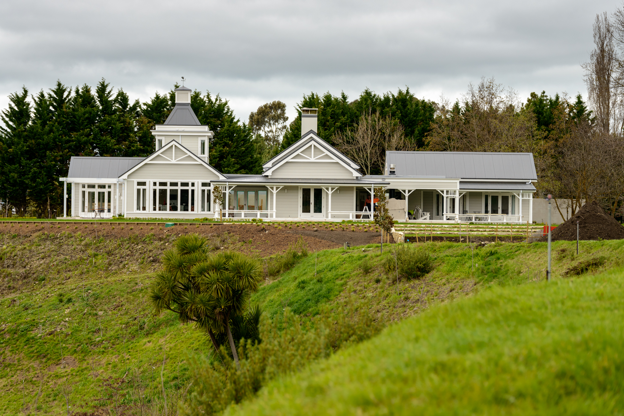 The house is designed to look like a farm house that has grown over time. The left end in this shot is the kitchen and main bedroom, the middle is the living area and the right end houses the guest bedrooms.
