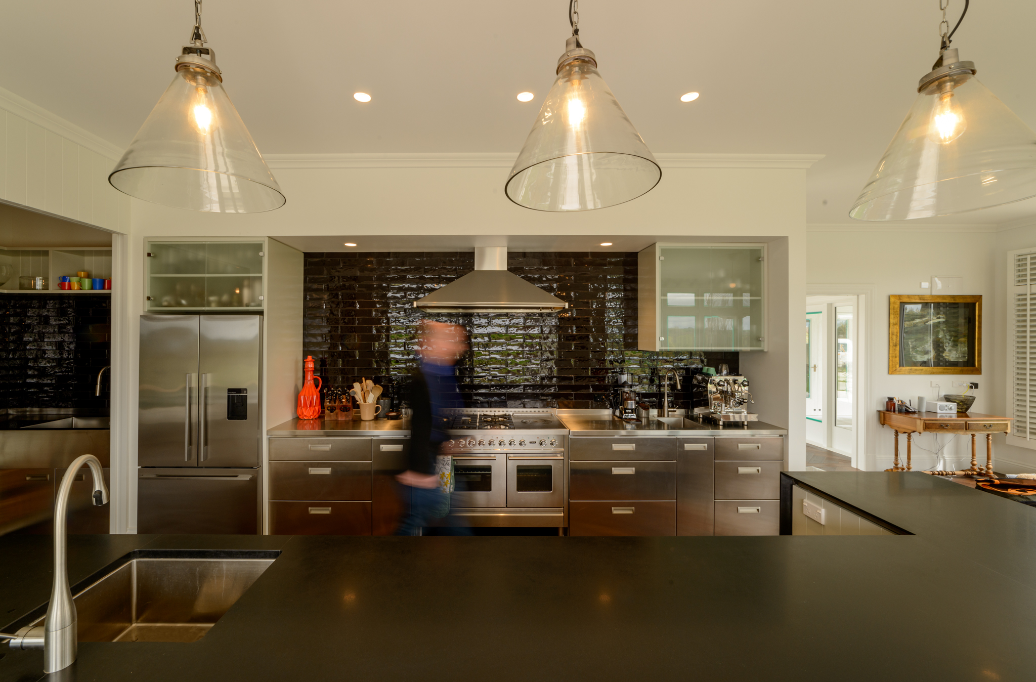 The kitchen is a mix of traditional farmhouse and modern semi-commercial