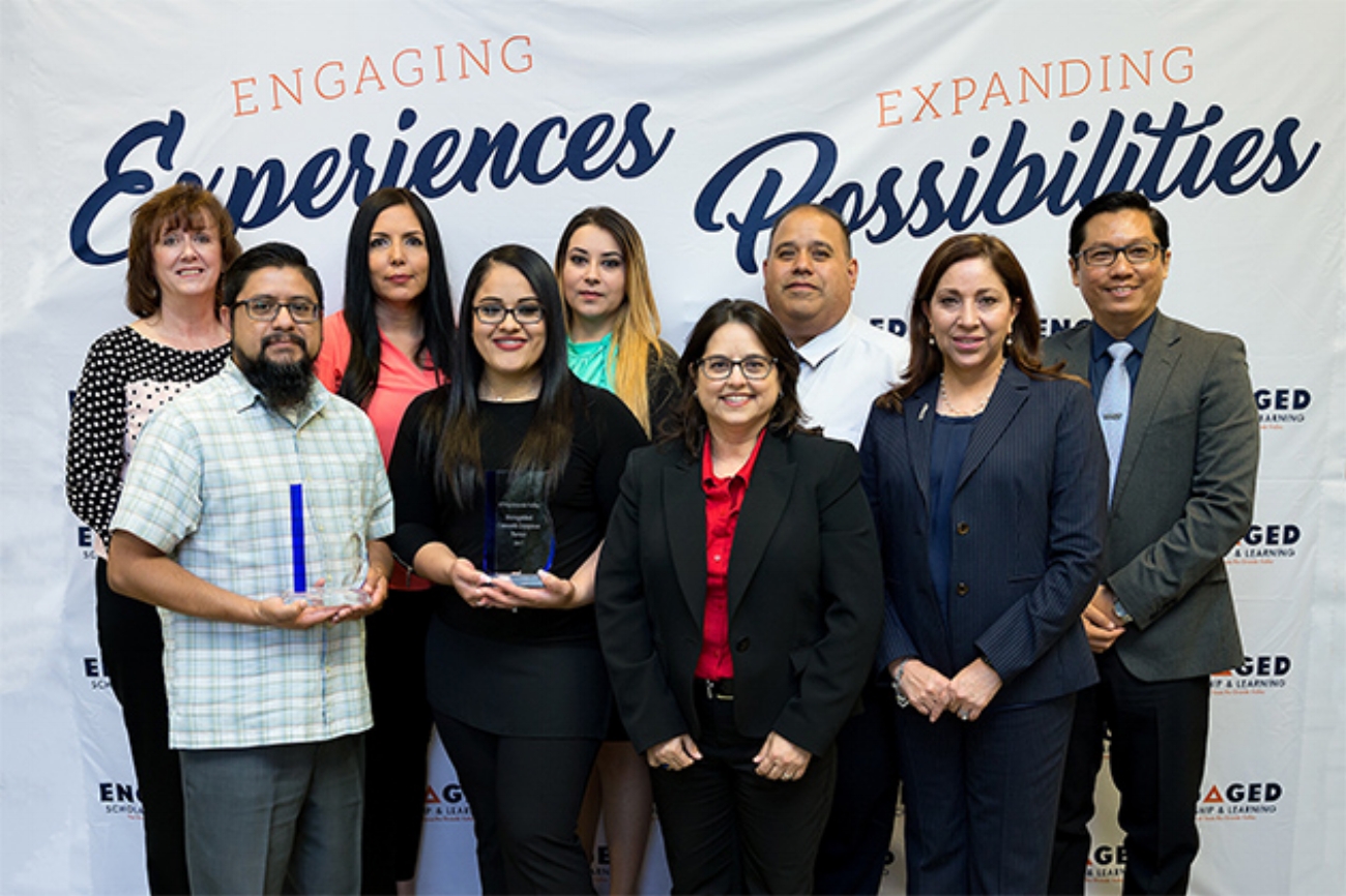 The University of Texas Rio Grande Valley honored the City of Edinburg Solid Waste Management and the United Way of South Texas Wednesday, April 19, with its Distinguished Community Engagement Partner Awards. Pictured in back, from left to right, are Jeanette Ahlenius, board member for United Way of South Texas; Janie Chapa, Dalinda Cardenas, Ramiro Gomez, all from the City of Edinburg Solid Waste Management; and Dr. Dean Kyne, UTRGV assistant professor of sociology. Pictured in front, from left to right, are Fidencio Mercado, United Way of South Texas board member and UTRGV clinical associate professor of rehabilitation services and counseling; Celene Gonzalez, City of Edinburg Solid Waste Management; Dr. Doris Mendiola, data and research manager, UTRGV Community Engagement and Assessment; and Cris Trejo, UTRGV assistant vice president for Community Engagement and Assessment. (Photo by Paul Chouy) 