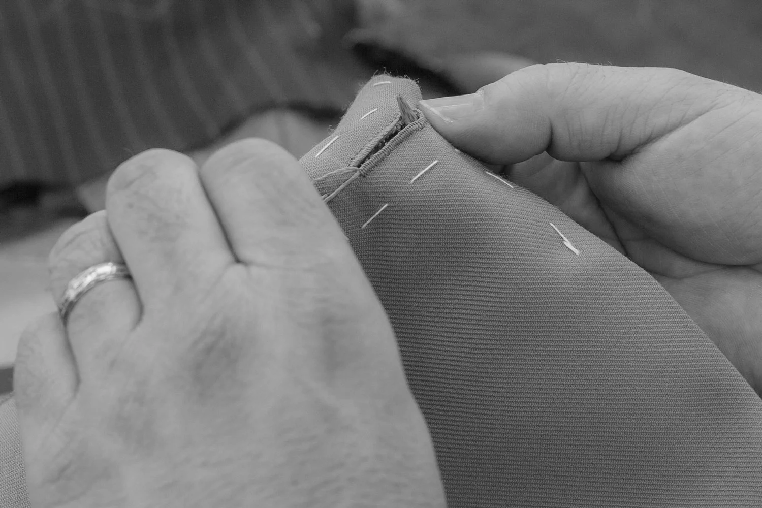 Hand stitch button holes Paul Henry Tailoring.jpg