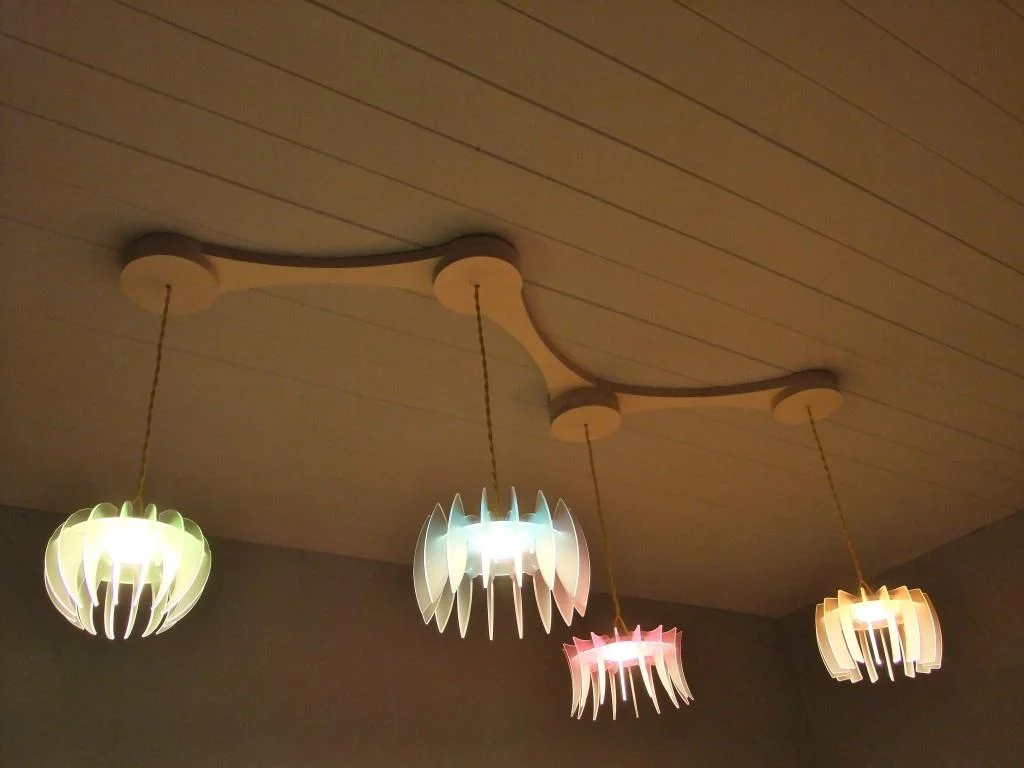 Linear ceiling rose with pendents and blades.