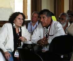 Wiccan Rachael Watcher translates for Argentine indigenous leader Raul Mamani, at an interfaith gathering.