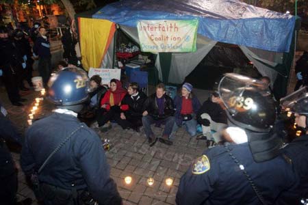 The police allow the Interfaith canopy to remain after the other tents at Oscar Grant Plaza were removed.