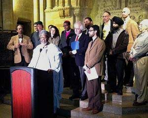 Rabbi Justus Baird, top row, far right, joins clergy from various faiths to protest the profiling and surveillance of Muslims by the NYPD earlier this year.
