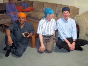 Interfaith collaboration means finding yourself in unlikely settings with friends from around the world. Here Mussie Hailu, l., Africa’s Golden Rule Ambassador, Paul McKenna, creator of the Golden Rule poster, and Sam Muyskens, executive director of Inter-Faith Ministries of Wichita, Kansas, sit together in Sikh head-scarves following a prayer service in Phoenix, Arizona.