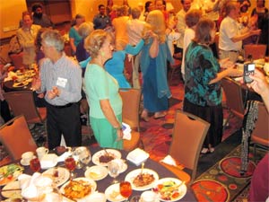 Good food, singing, and even a line-dance, caught at this North American Interfaith Network dinner, enhances hospitality, a sense of connectedness, and the friendly relations that nurture healthy interfaith relationships.