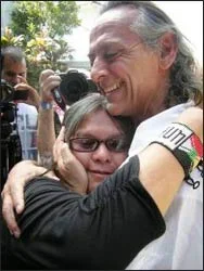 Francisco Ortiz, initiator of Day One, embraces Mona Palacca, of the 13 Indigenous Grandmothers