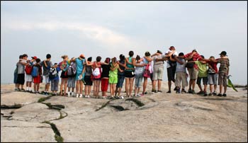 Climbing Stone Mountain in Georgia, a steep climb on a hot day, new interfaith friends spurred each other on to the top at the Kids4Peace camp. – Photo: Kits4Peace