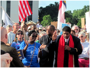 Rev. William Barber speaking at a Moral Monday gathering – Photo: Wikipedia, twbuckner