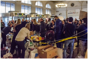 Syrian refugees being registered after arriving at a train station in Stockholm – Photo: Wikimedia Commons, Frankie Fouganthin