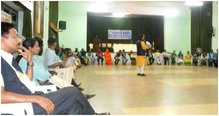 A plenary session being held in-the-round.